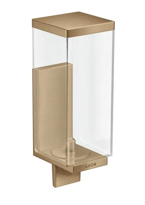 Transparenter Lotionenspender mit gebürstetem Bronze-Boden. Hersteller: AXOR. Das Design ist rechteckig und eignet sich zur Wandmontage.